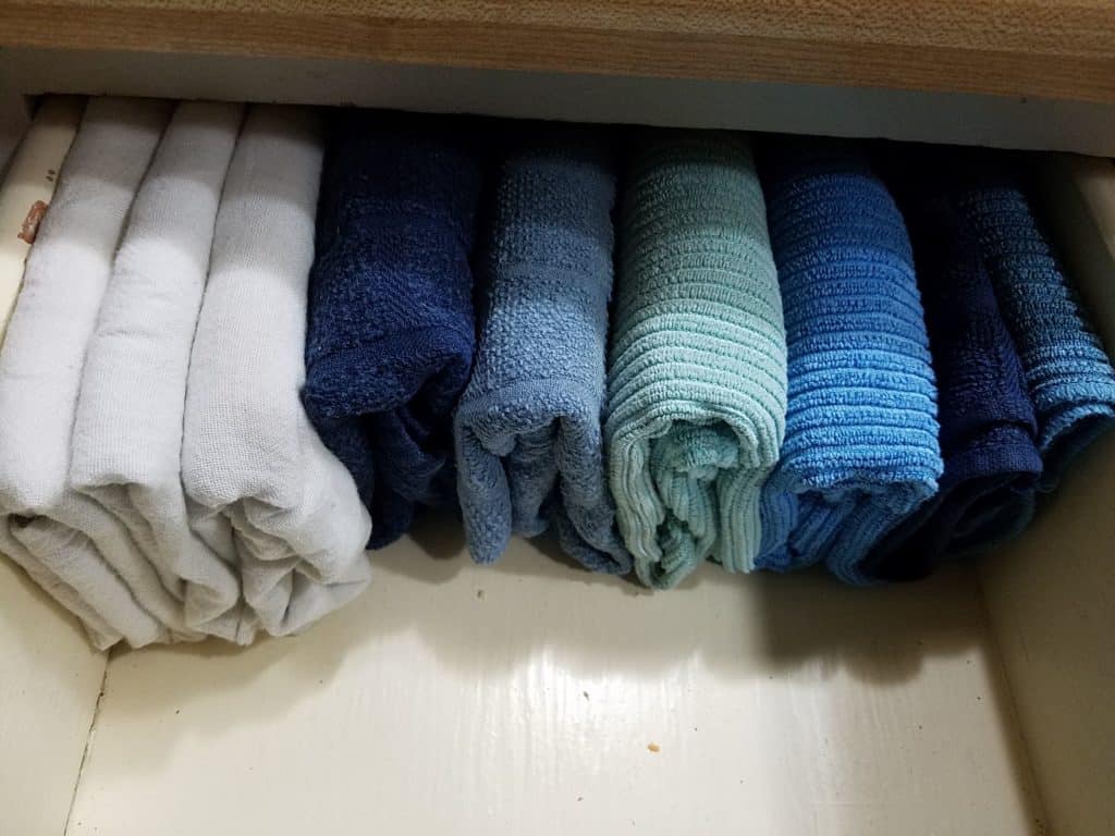 konmari folded kitchen towels in a drawer