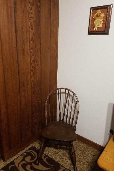 rocking chair and sentimental picture on the wall